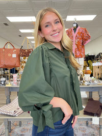 The juniper top - Forest green wrap-style blouse with a pointed collar, scalloped trim, and voluminous balloon sleeves with tie cuffs