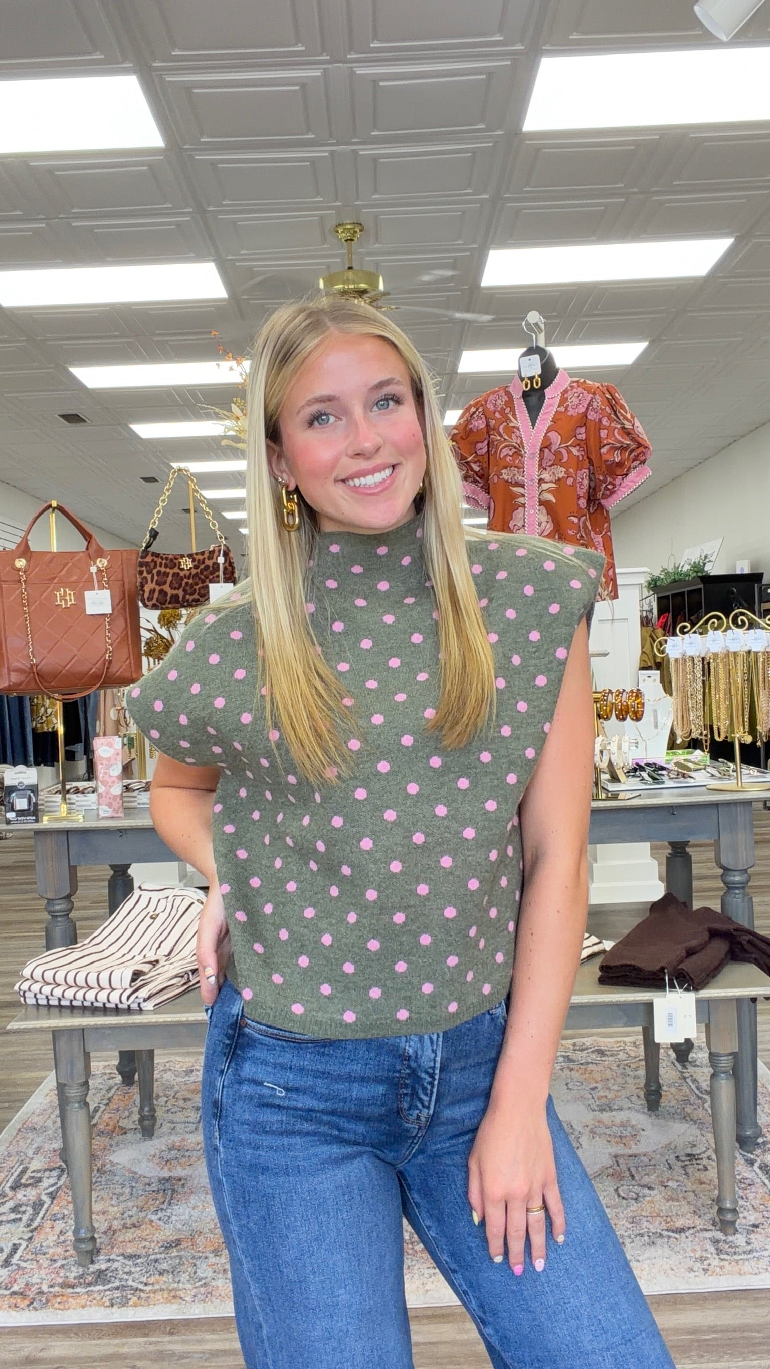 The Evie sweater - Olive knit short-sleeve sweater top with pink polka dots, featuring a high crew neckline, relaxed boxy fit, and lightweight sweater-knit construction. Entro