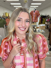 Pink Pumpkin Spice Top - Vibrant pink and orange printed top featuring a playful mix of stripes and geometric patterns, statement puff sleeves, and feminine ruffle detailing.