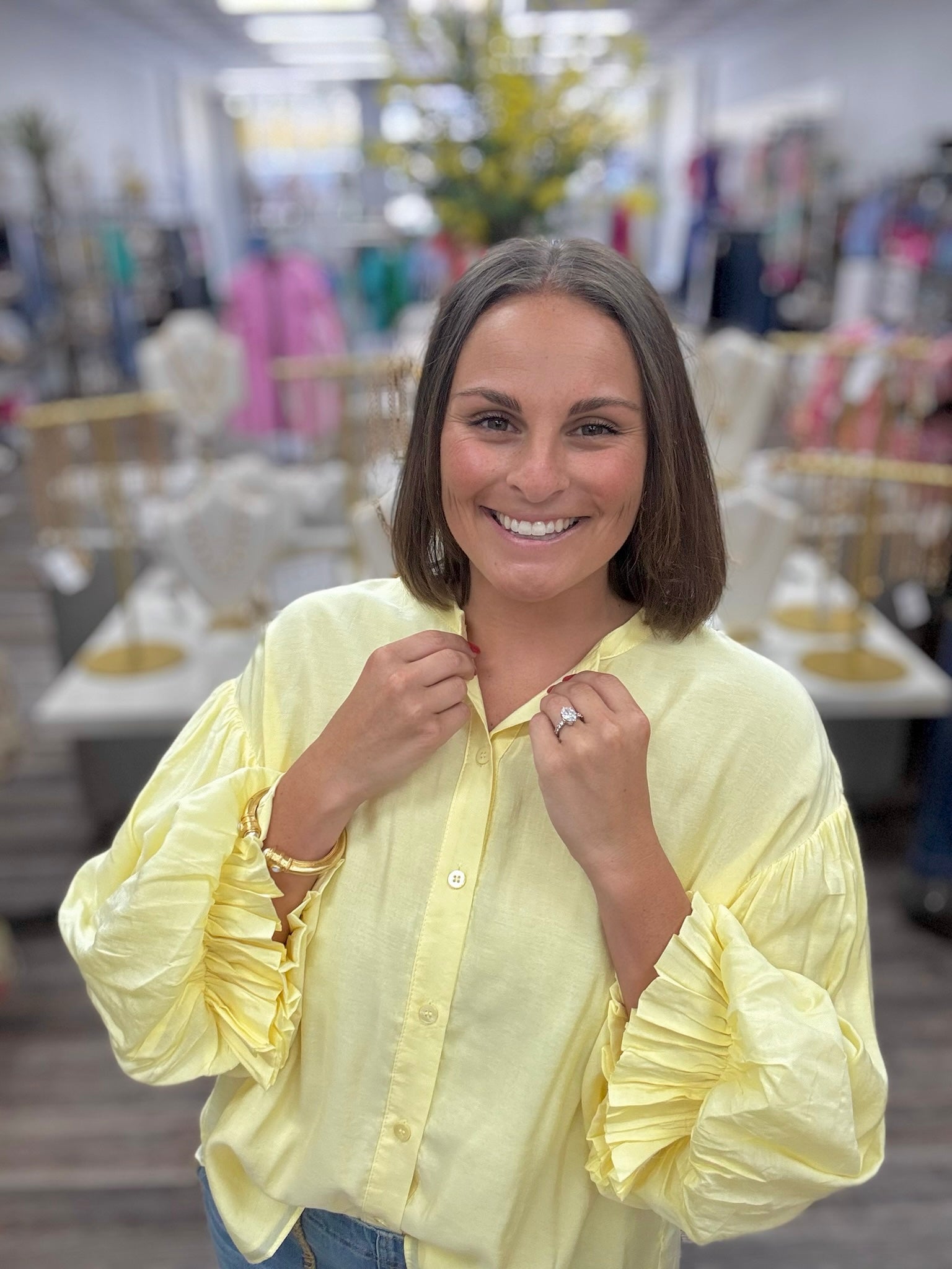 The Joy blouse - A butter-yellow collarless blouse featuring voluminous bishop sleeves, a minimalist button-front placket, and an easy oversized silhouette.