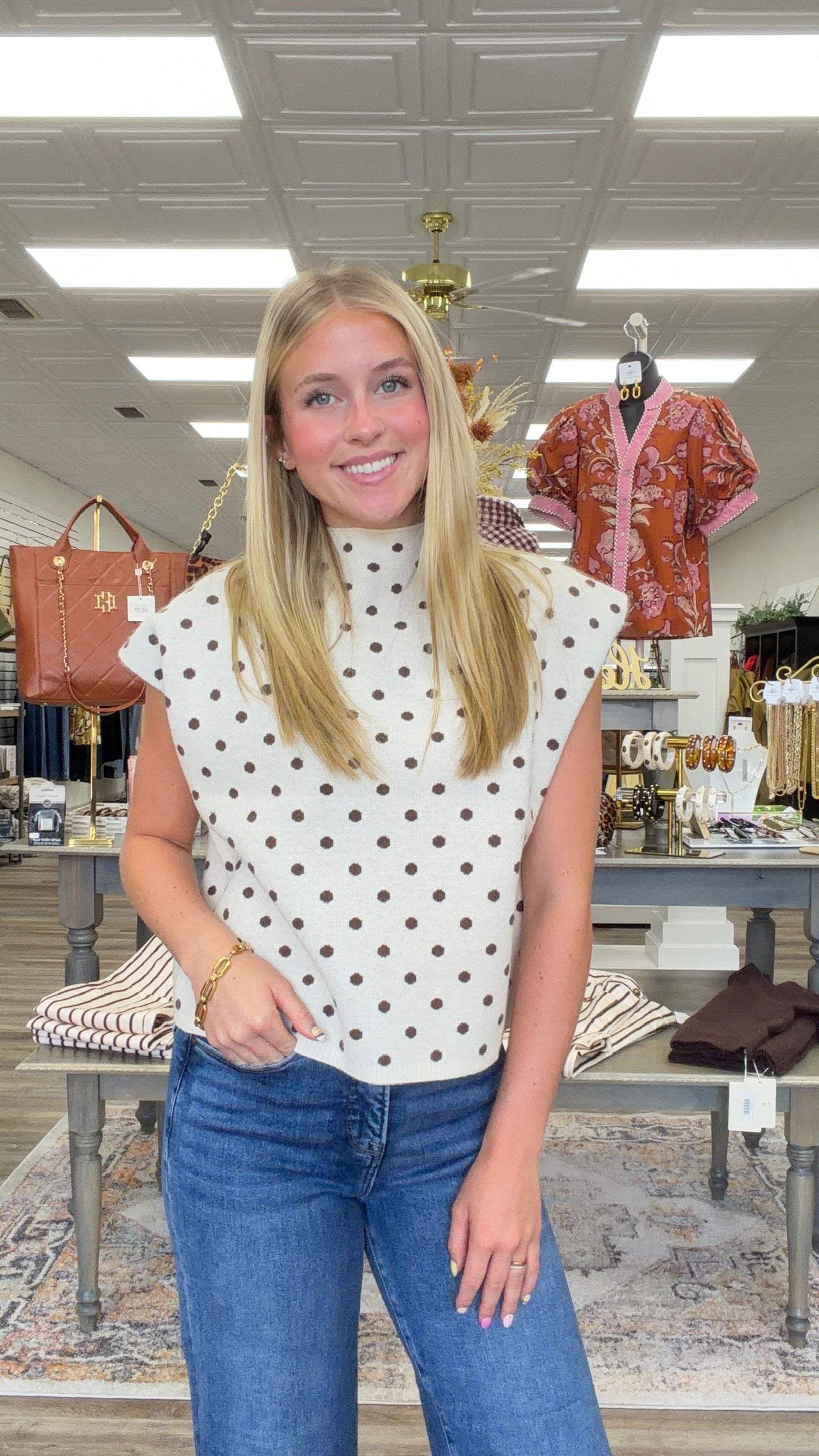 The Evie sweater - A cream knit short-sleeve sweater top with brown polka dots, featuring a high crew neckline, relaxed boxy fit, and lightweight sweater-knit construction. Entro