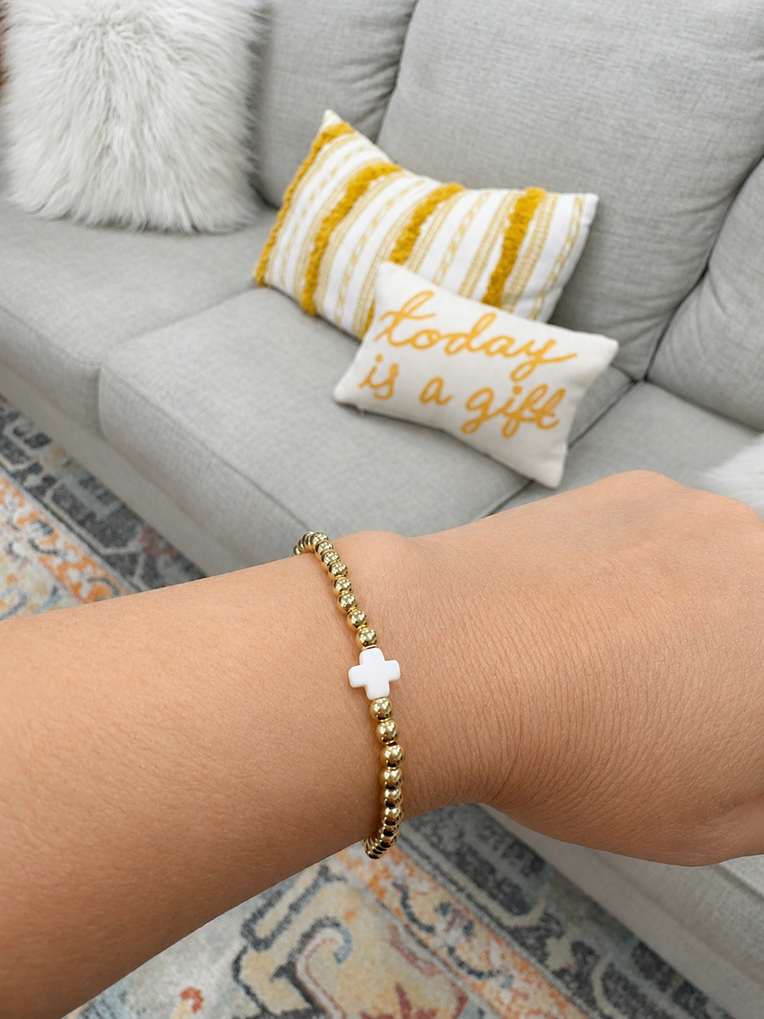 Stretch beaded bracelet with white cross accent- steel 18 karat gold overlay
