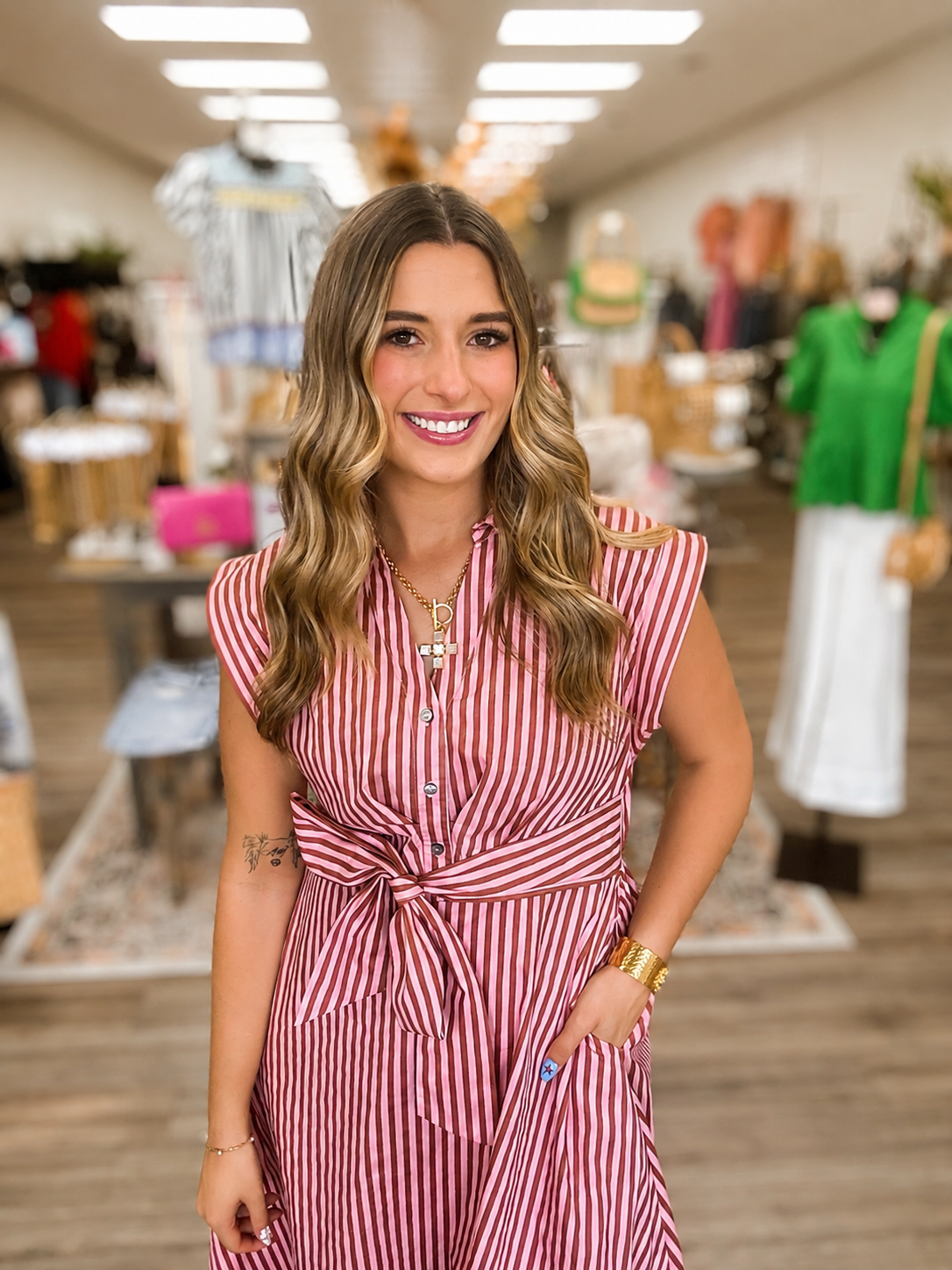 The Rosy Stroll Striped Shirt Dress. This dress features a lightweight woven fabric, collared neckline, short cap sleeves and a adjustable self-tie waist-Entro