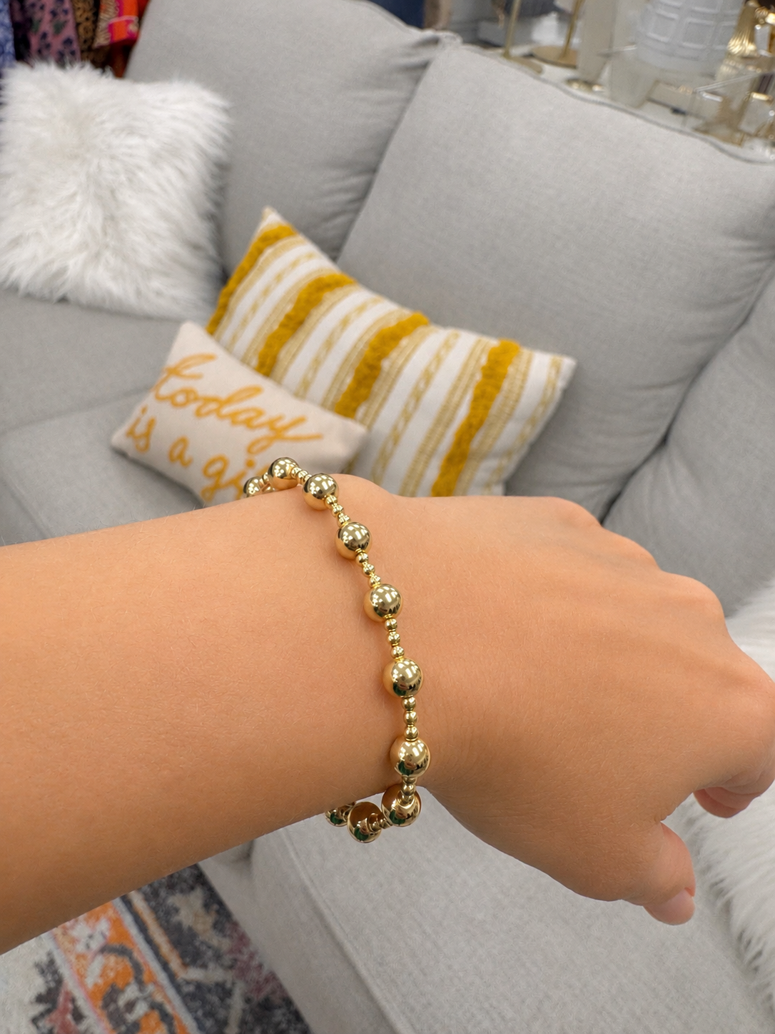 Stretch beaded stackable gold bracelet with small and larger beads– steel 18 karat gold overlay