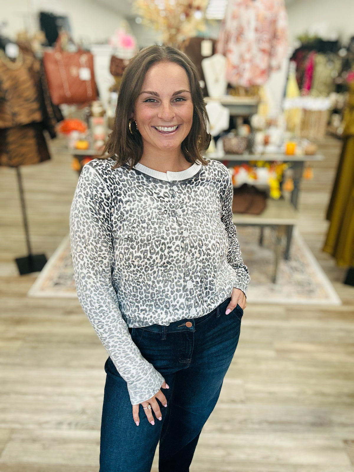 The Charlotte cardigan - This lightweight cardigan features a leopard print in soft shades of grey, cream, and taupe, accented with classic ribbed trim and a button-front closure.